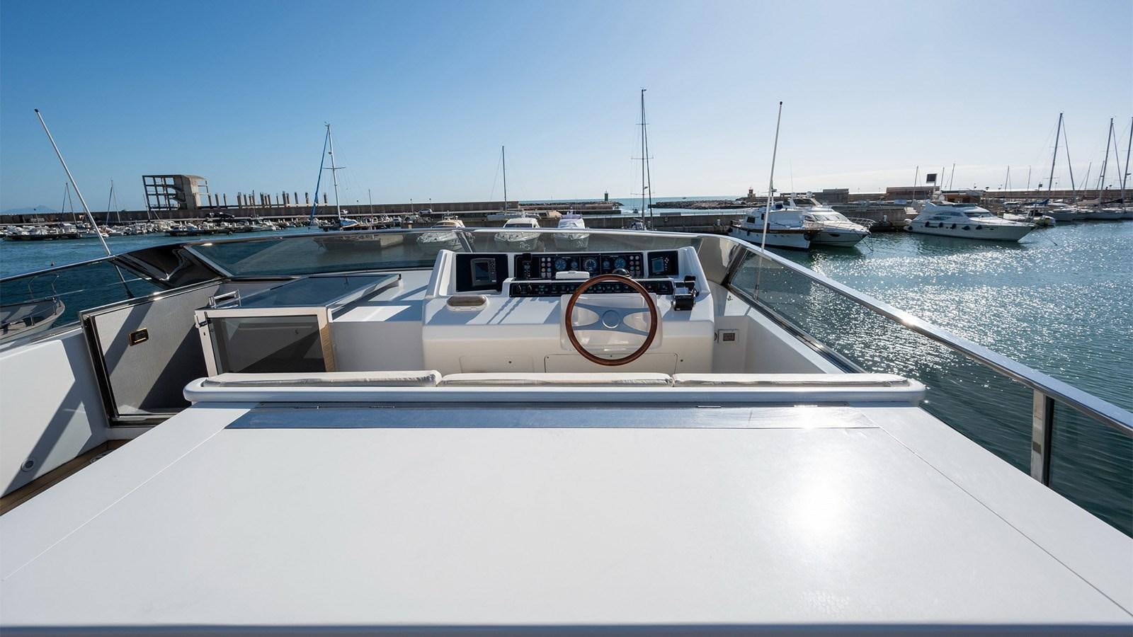 a white boat on a dock aboard FIRST LADY II Yacht for Sale