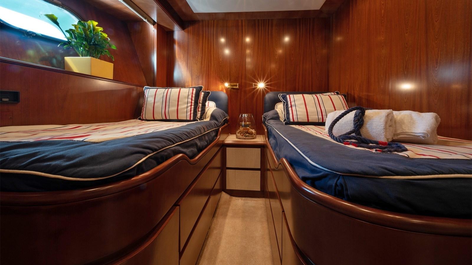 a couple of beds in a room aboard FIRST LADY II Yacht for Sale