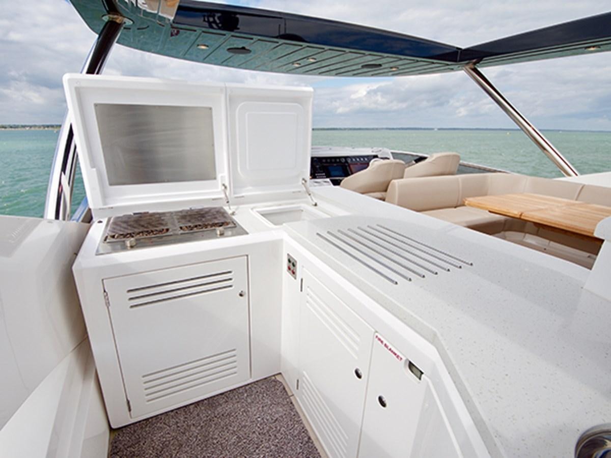 a boat with a laptop on the deck aboard LADY O Yacht for Sale