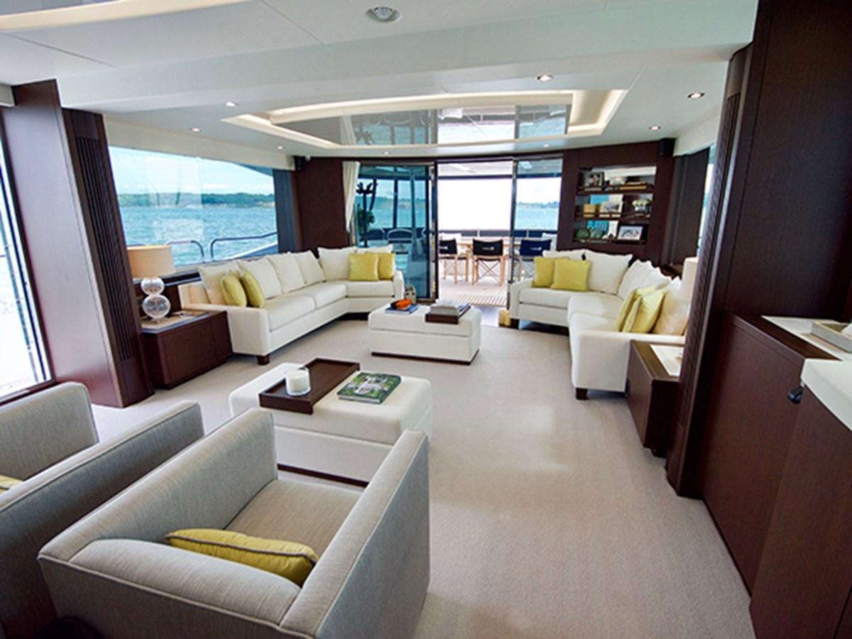 a living room with a large window aboard LADY O Yacht for Sale