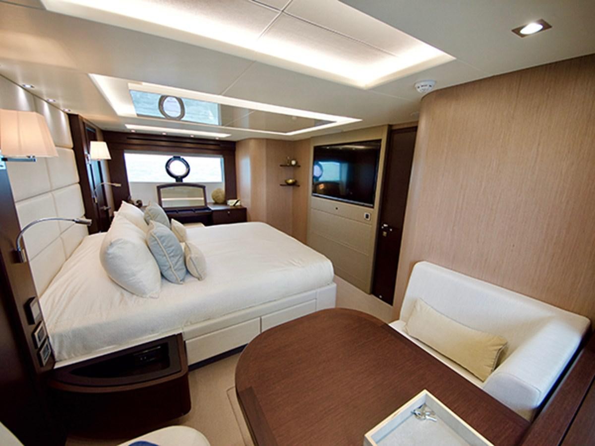 a hotel room with a bed and a television aboard LADY O Yacht for Sale