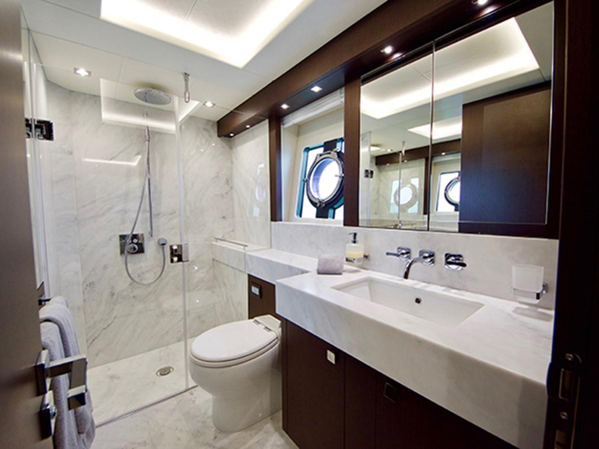 a bathroom with a large mirror aboard LADY O Yacht for Sale