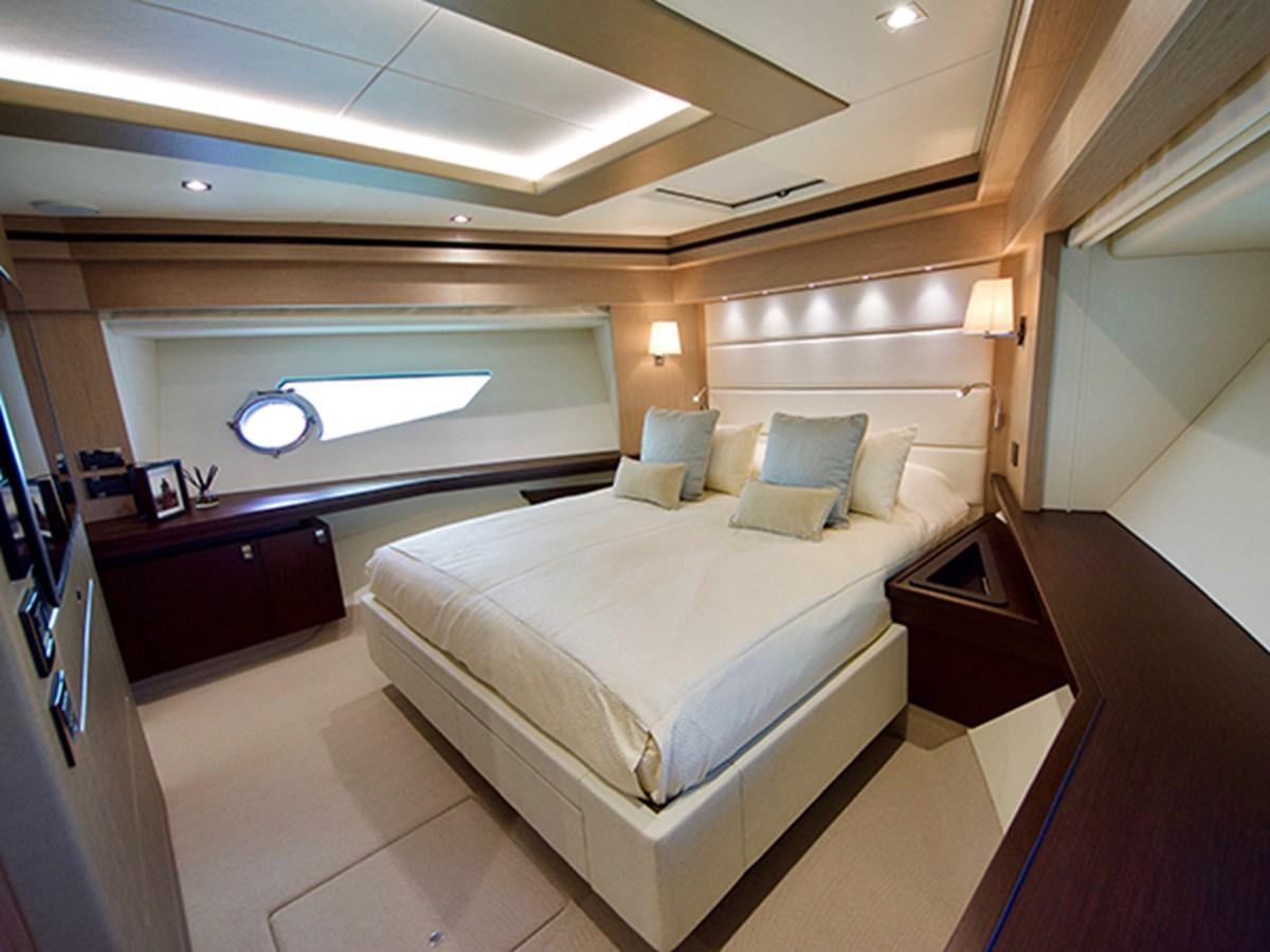 a room with a bed and a window aboard LADY O Yacht for Sale
