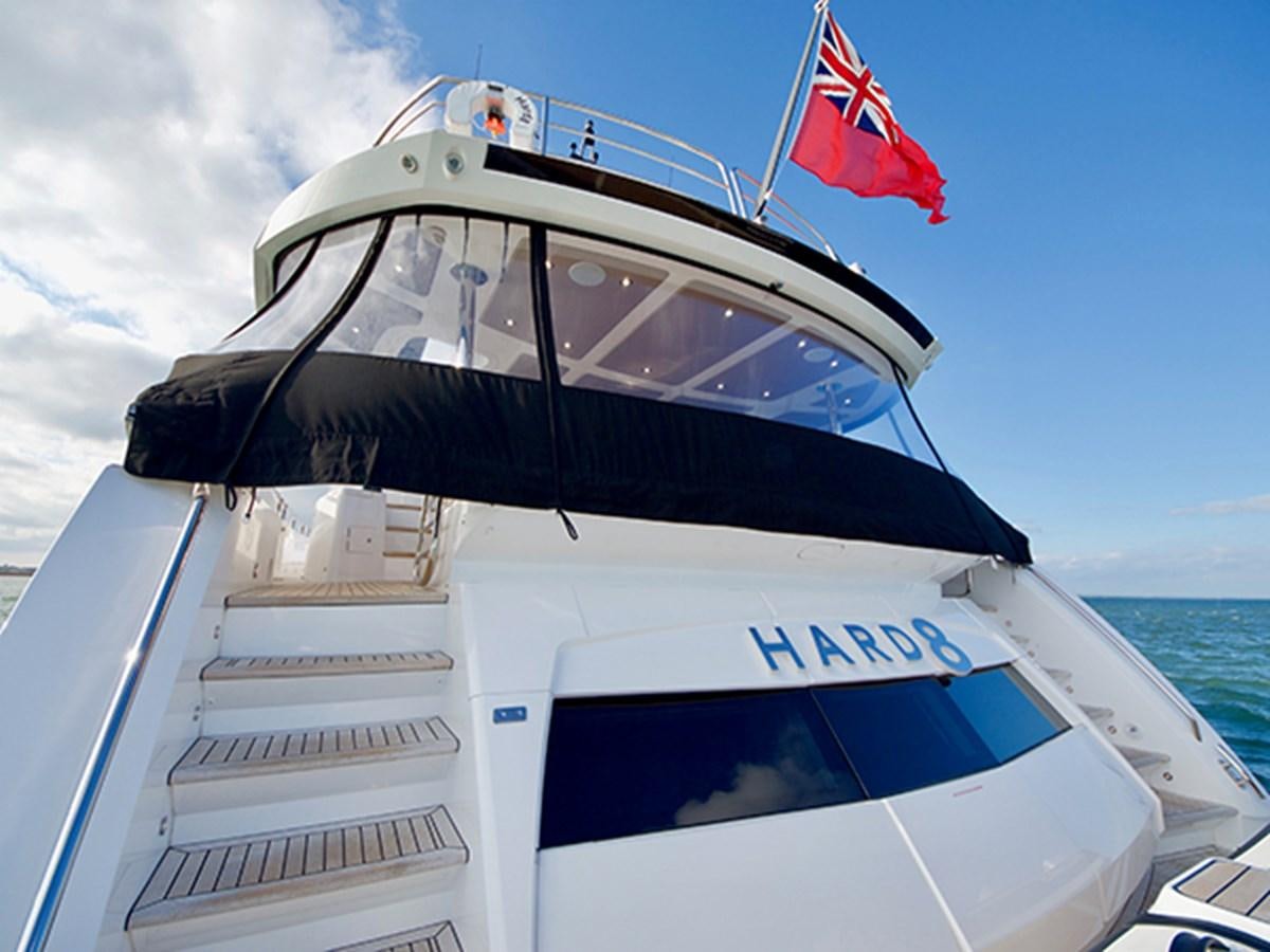 a boat with a flag on the front aboard LADY O Yacht for Sale