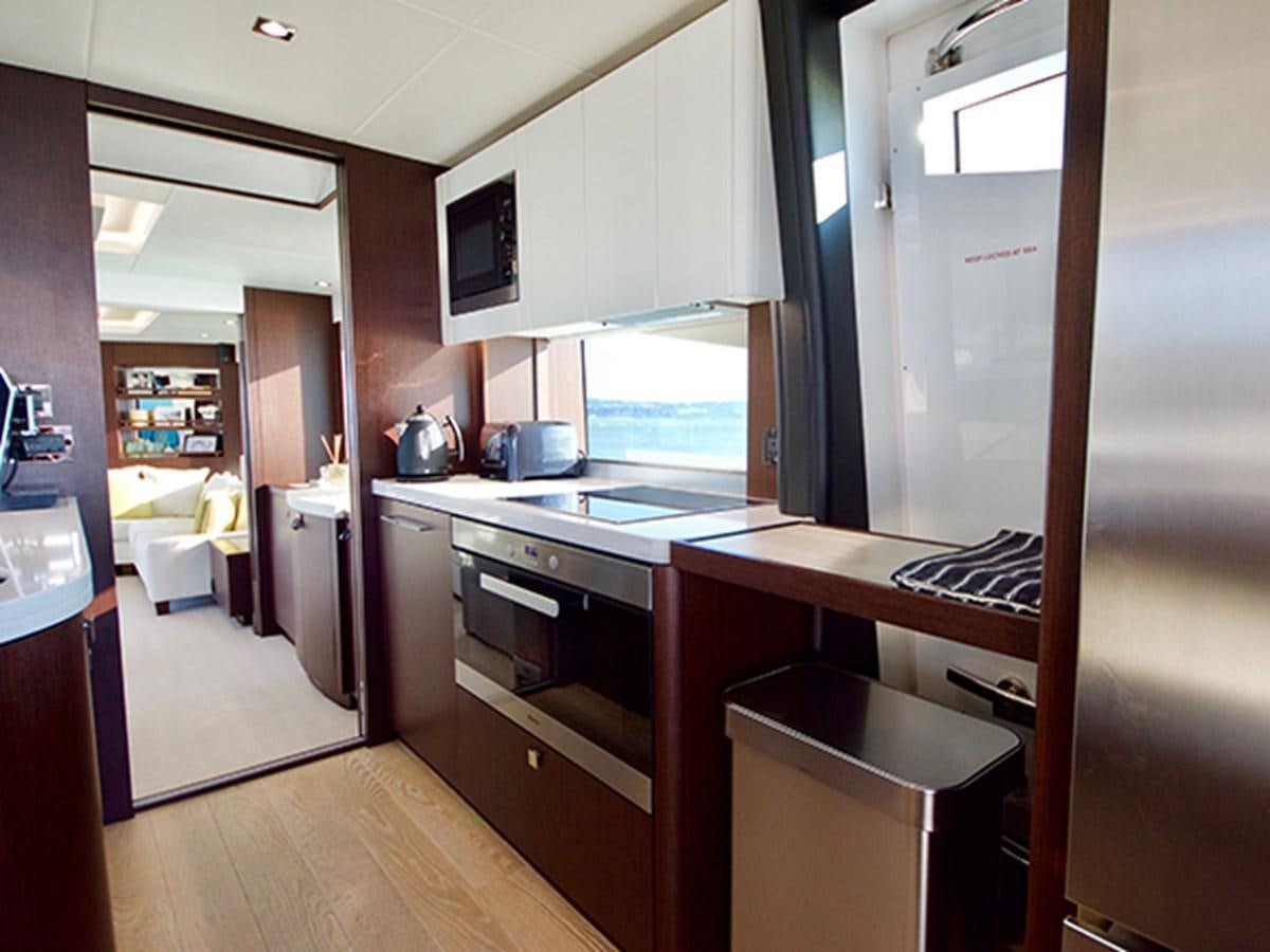 a kitchen with a large window aboard LADY O Yacht for Sale