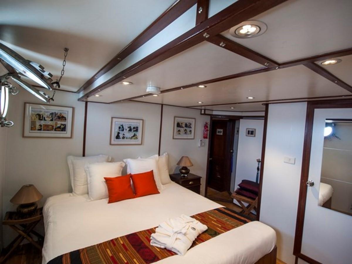 a hotel room with a bed aboard KAMA BAY Yacht for Sale