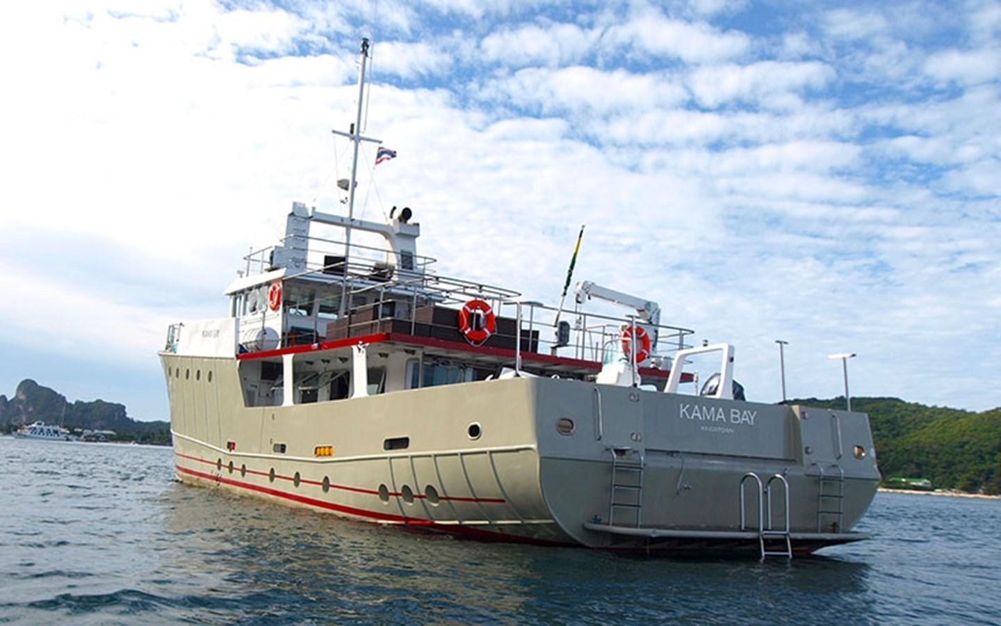 a large boat in the water aboard KAMA BAY Yacht for Sale