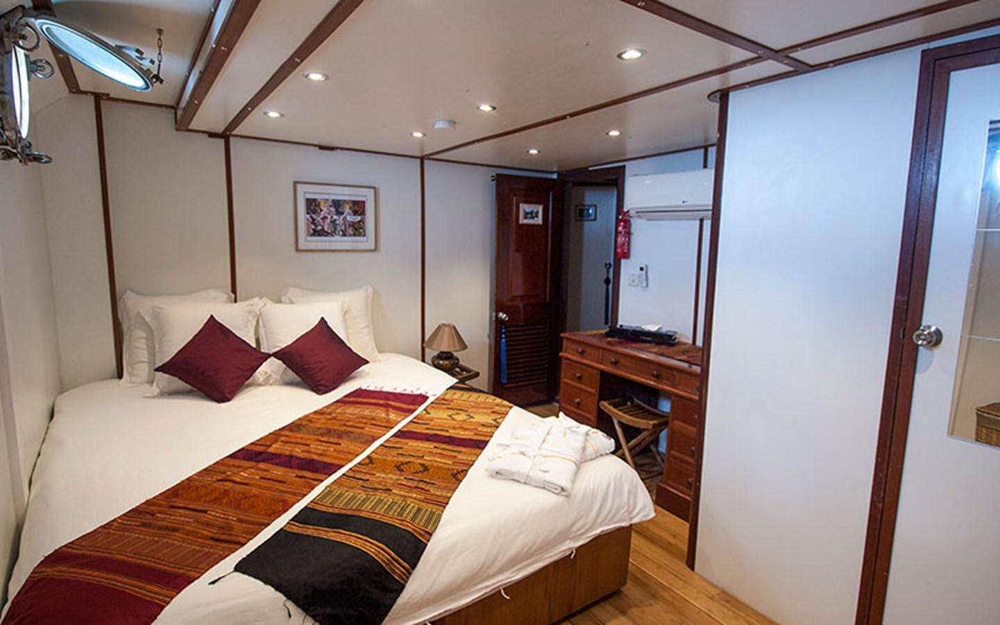 a hotel room with a bed aboard KAMA BAY Yacht for Sale