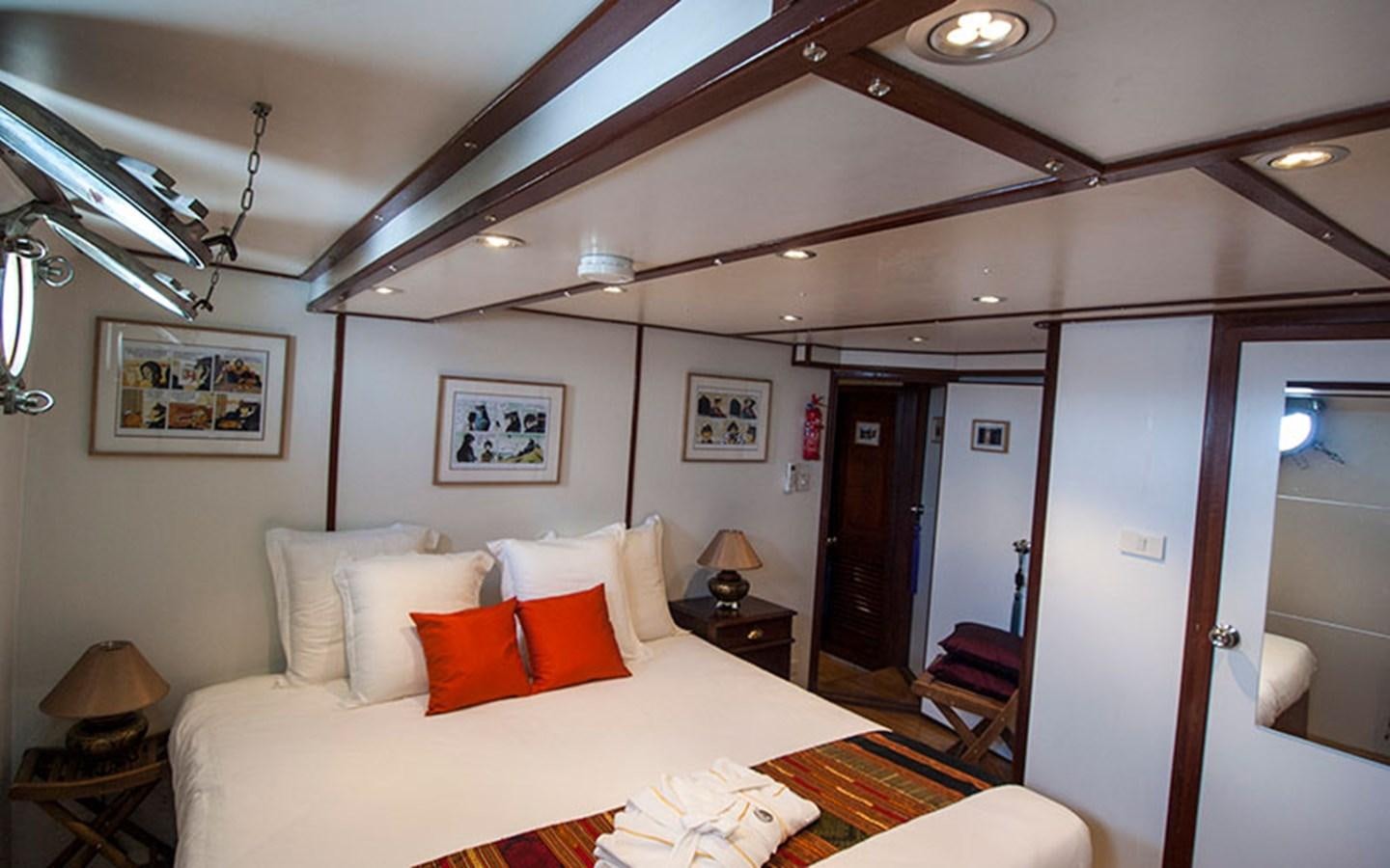 a hotel room with a bed aboard KAMA BAY Yacht for Sale