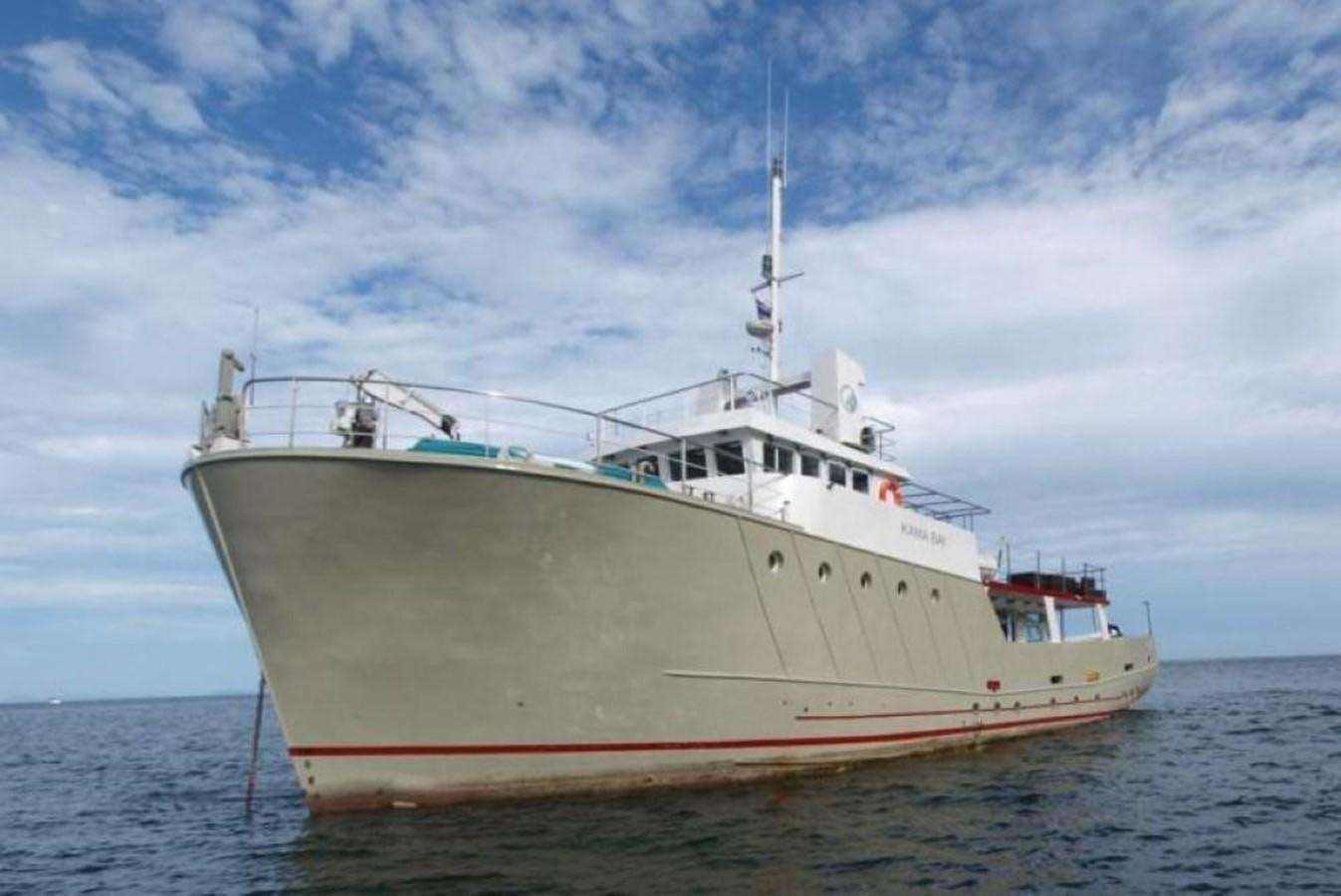 a large white ship in the water aboard KAMA BAY Yacht for Sale