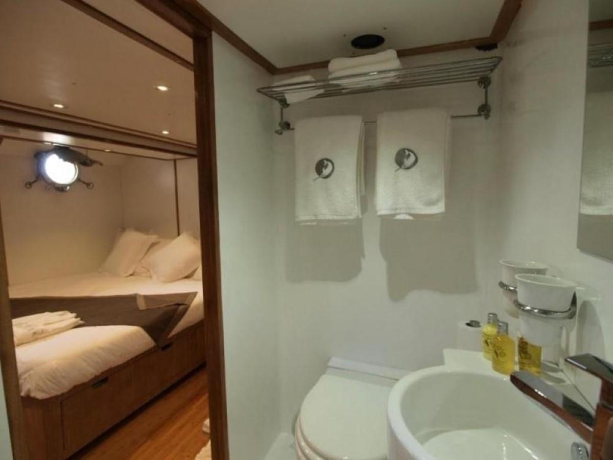 a bathroom with a sink and a mirror aboard KAMA BAY Yacht for Sale