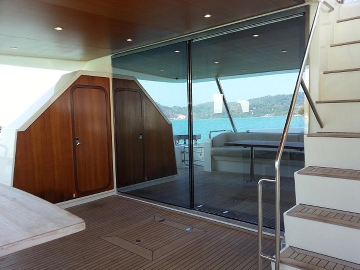 a room with a glass door and a bed aboard MY JAYA Yacht for Sale