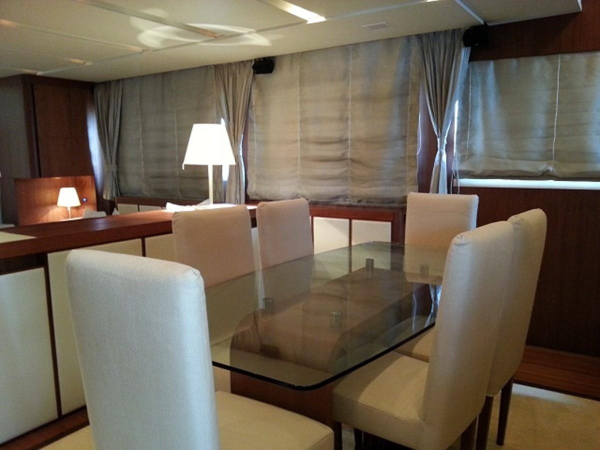 a room with chairs and a table aboard MY JAYA Yacht for Sale