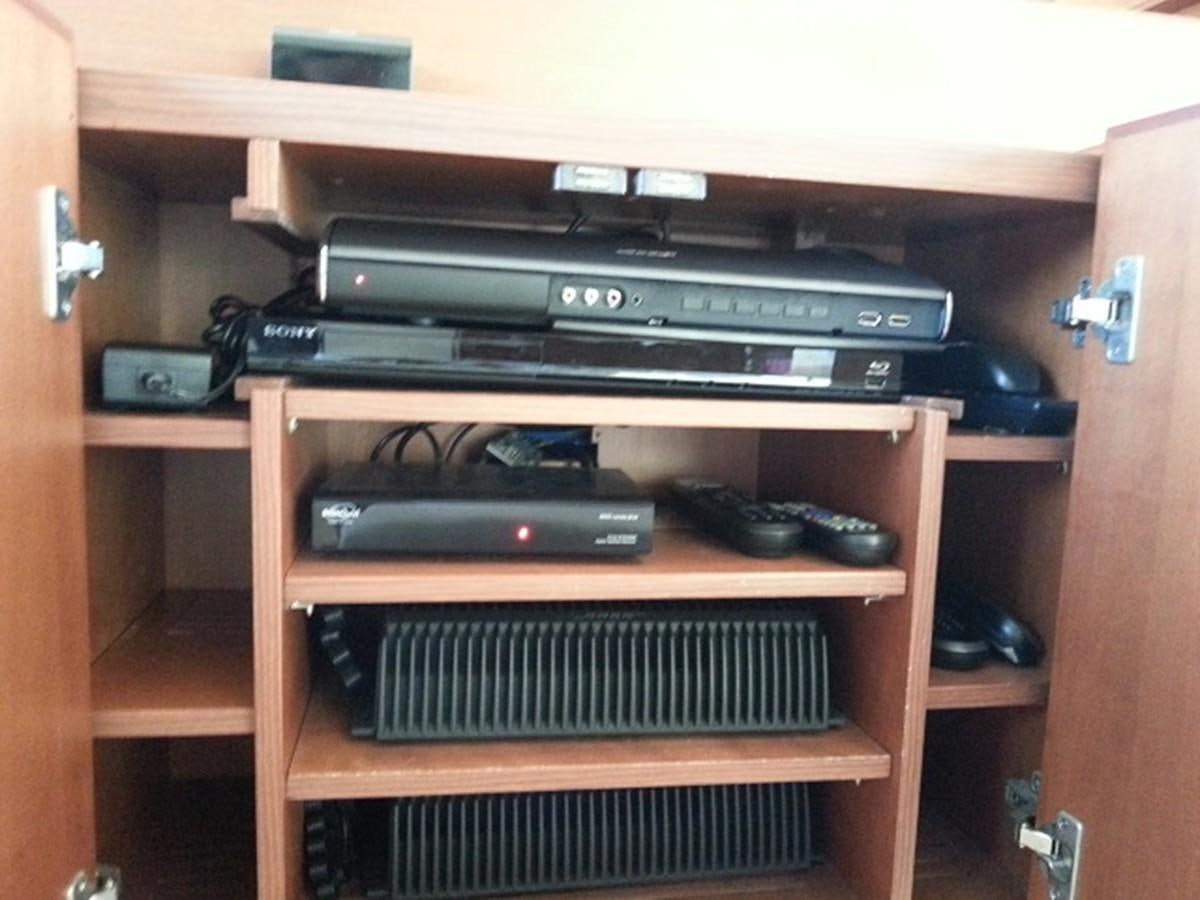 a shelf with electronics aboard MY JAYA Yacht for Sale