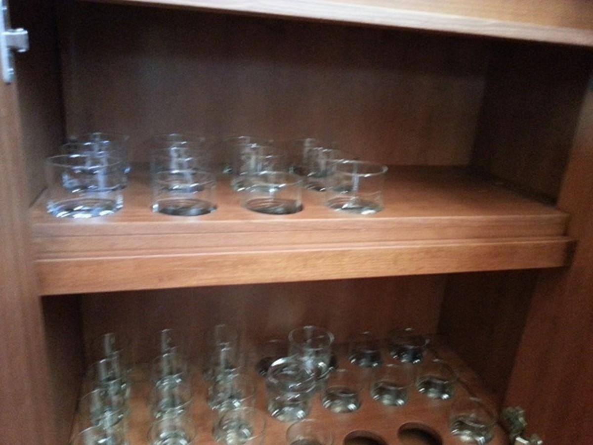 a shelf with many glass jars on it aboard MY JAYA Yacht for Sale