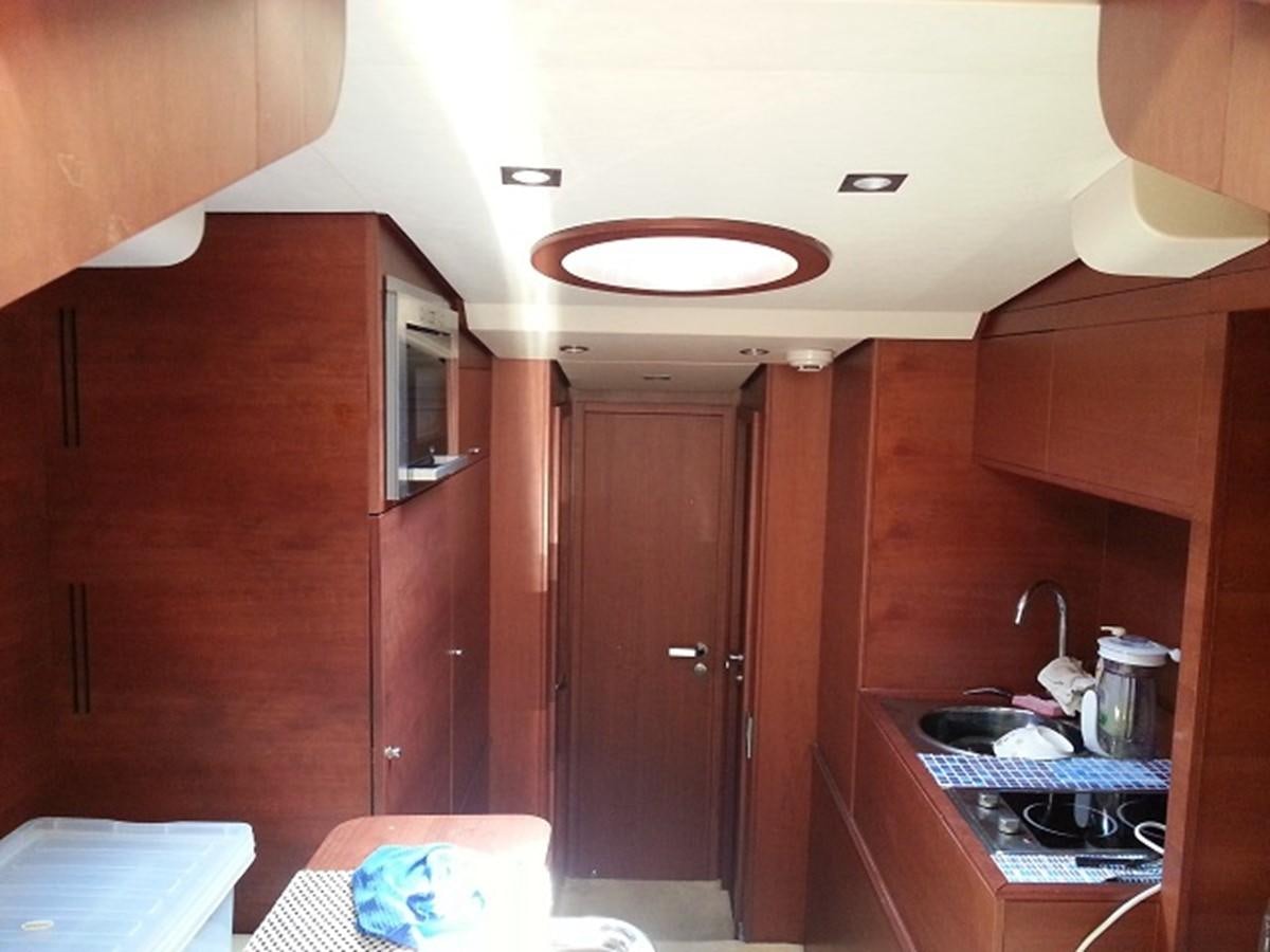 a kitchen with wooden cabinets aboard MY JAYA Yacht for Sale