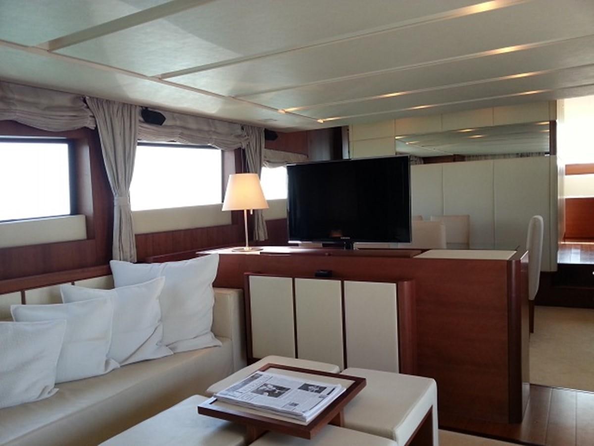 a room with a bed and a desk aboard MY JAYA Yacht for Sale