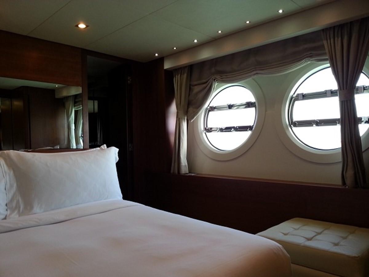 a bed with white sheets aboard MY JAYA Yacht for Sale