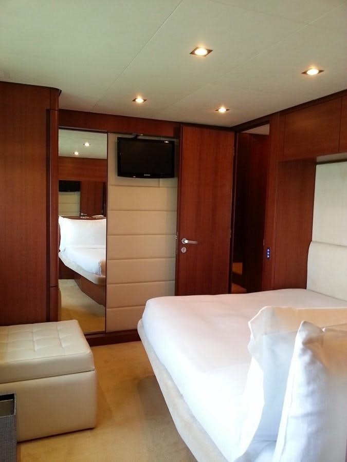 a hotel room with a bed and tv aboard MY JAYA Yacht for Sale