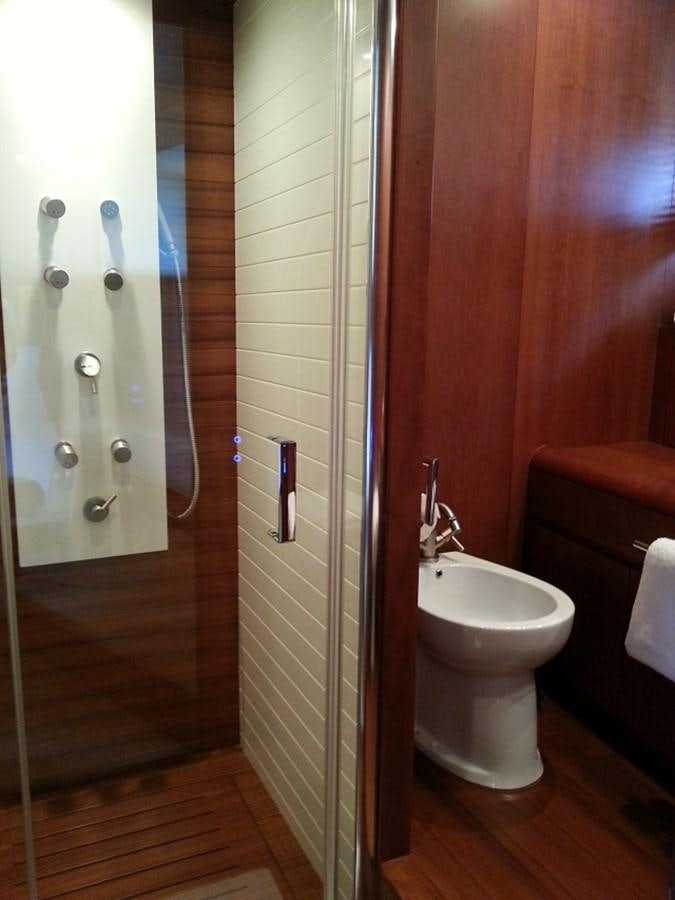 a bathroom with a toilet and a sink aboard MY JAYA Yacht for Sale