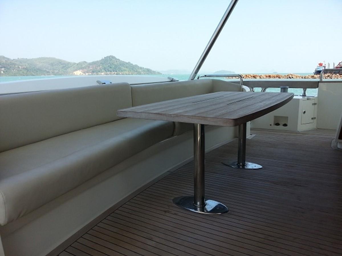 a table on a deck aboard MY JAYA Yacht for Sale