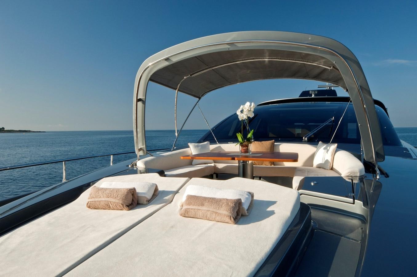 a boat with a flower on the front aboard RHINO A Yacht for Sale
