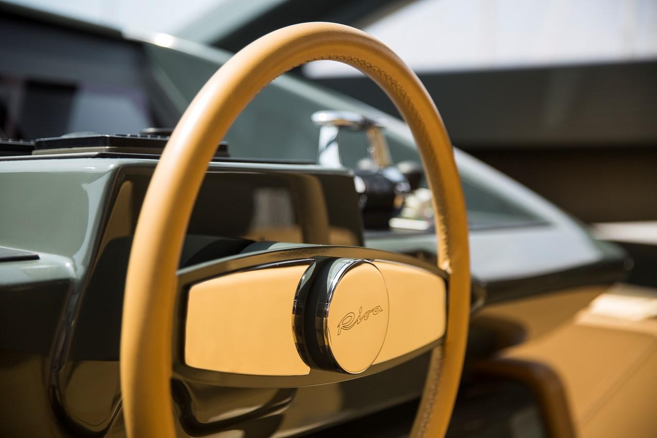 a yellow car with a round mirror aboard RHINO A Yacht for Sale