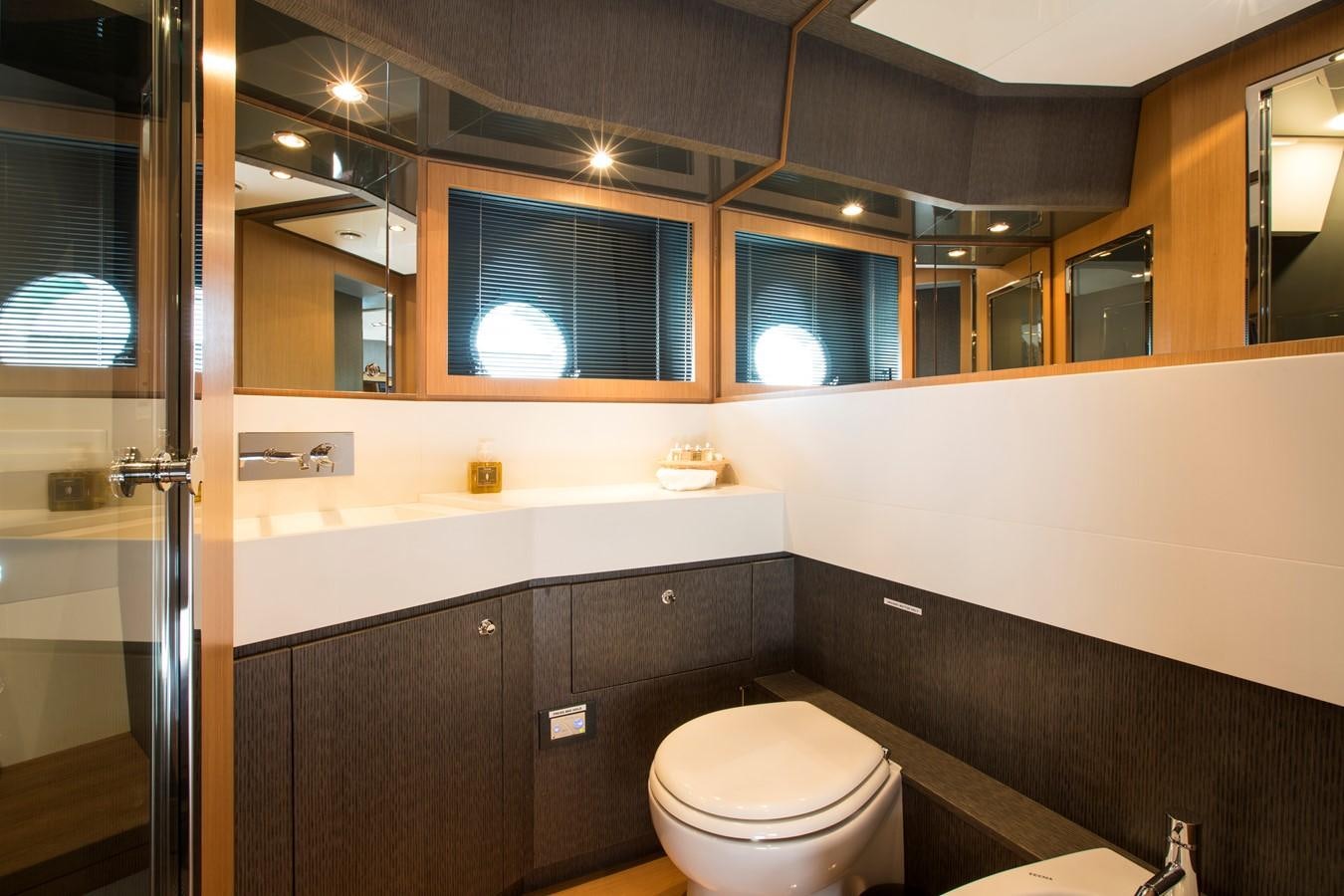 a bathroom with a toilet and a sink aboard RHINO A Yacht for Sale