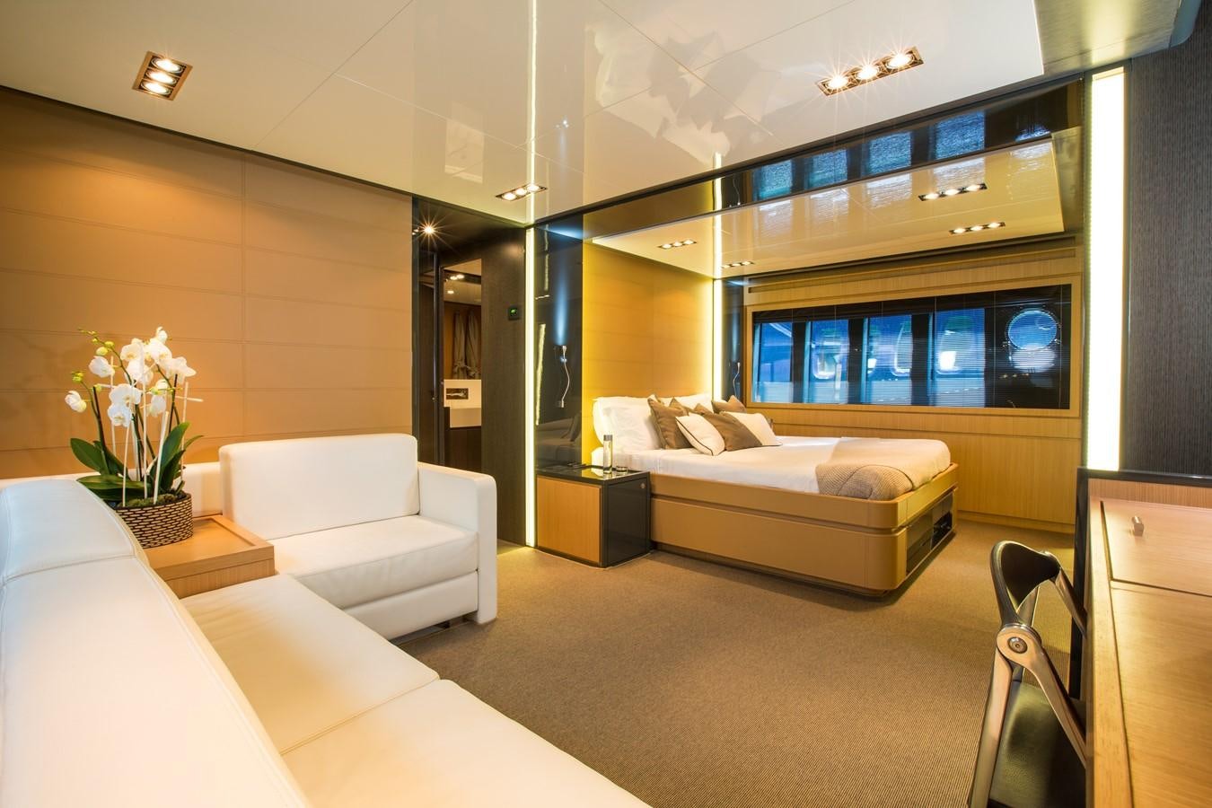 a room with a couch and a tv on the wall aboard RHINO A Yacht for Sale