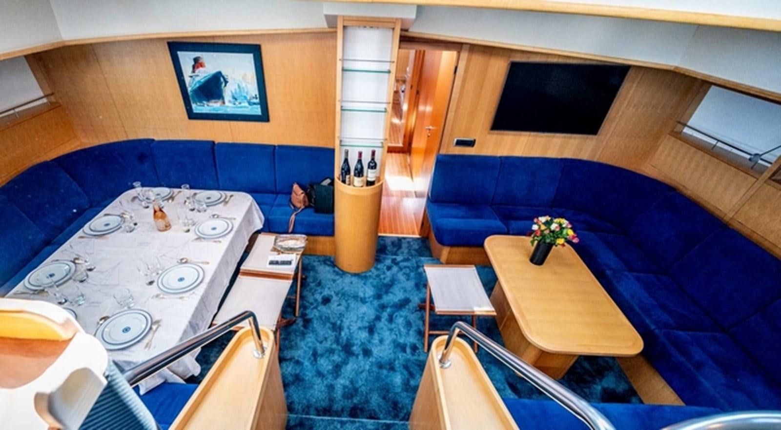 a room with a couch and a table aboard FANI Yacht for Sale