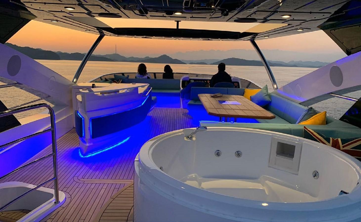 a group of people sitting in a pool aboard SKYE Yacht for Sale