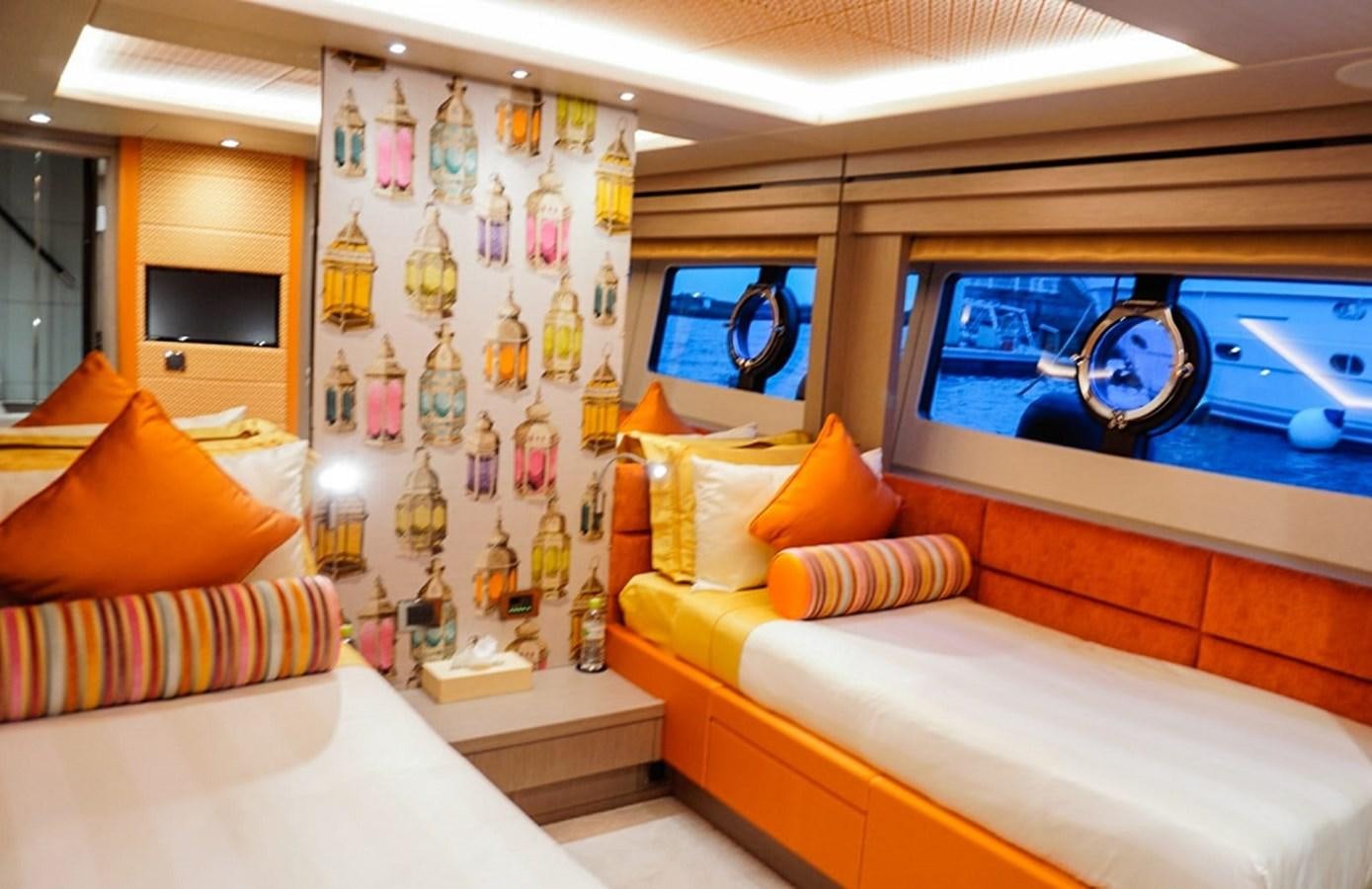 a room with a bed and a tv aboard SKYE Yacht for Sale