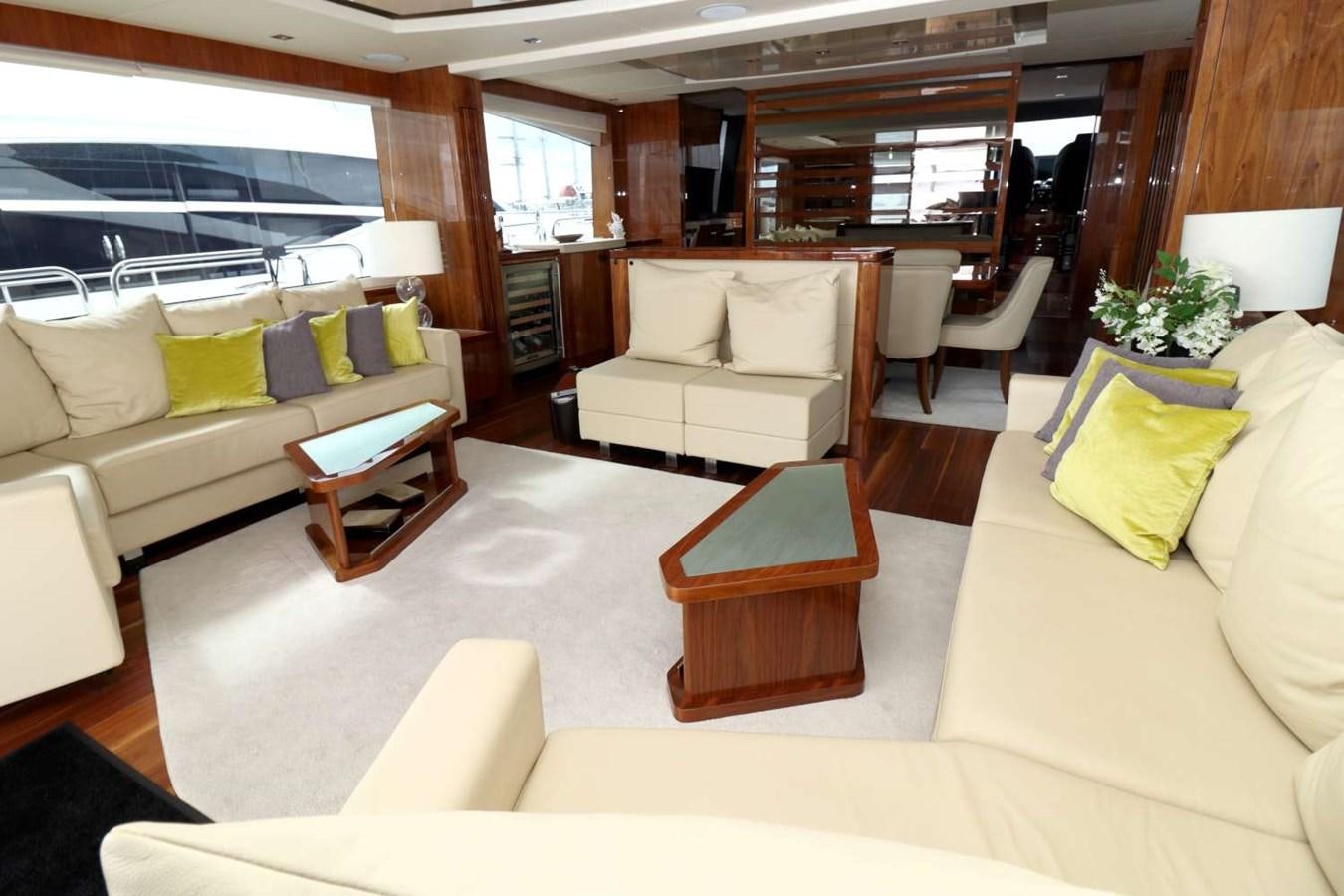 a living room with a couch and a coffee table aboard SUNSEEKER 86 Yacht for Sale