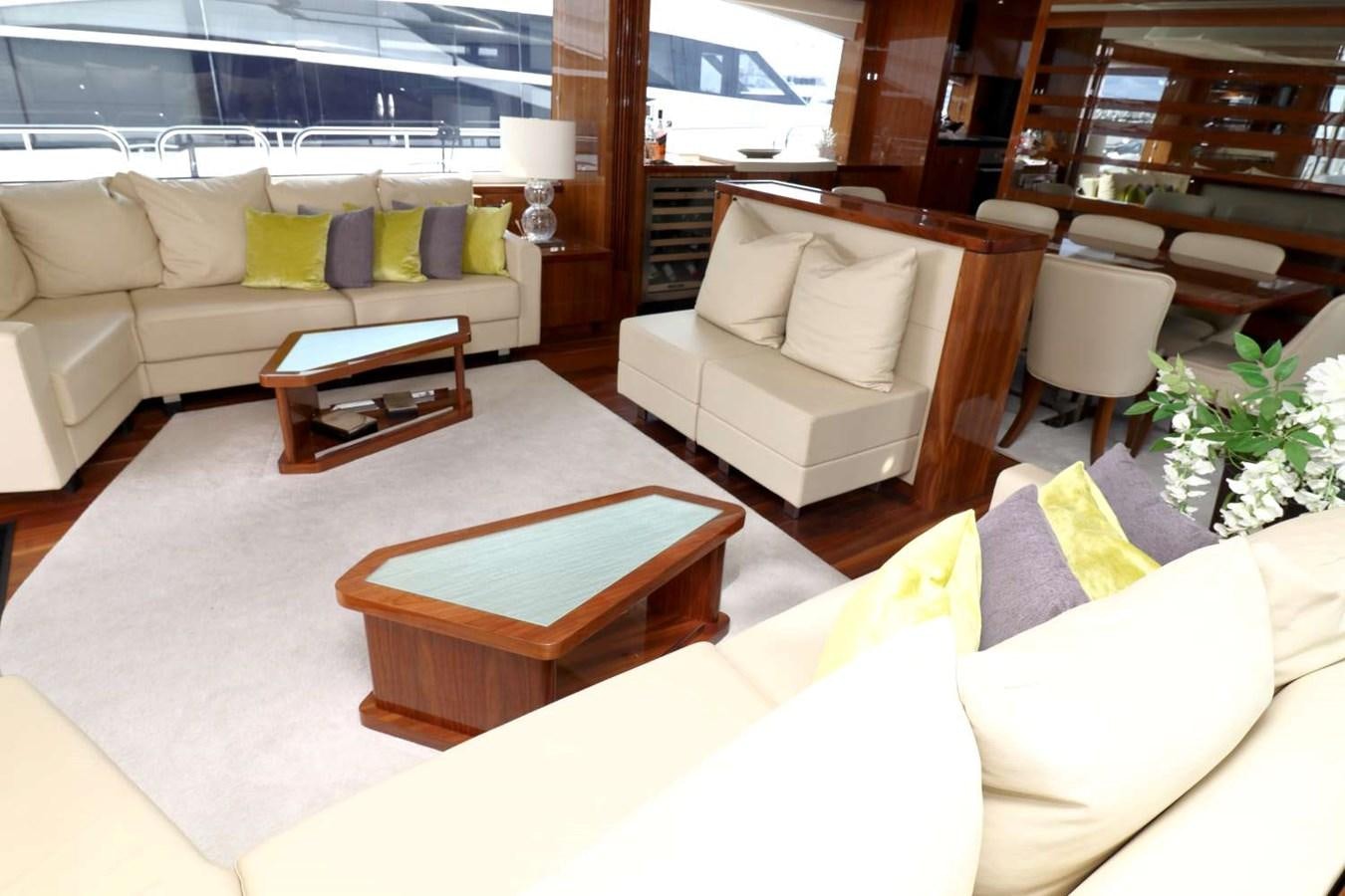 a living room with a couch and a coffee table aboard SUNSEEKER 86 Yacht for Sale