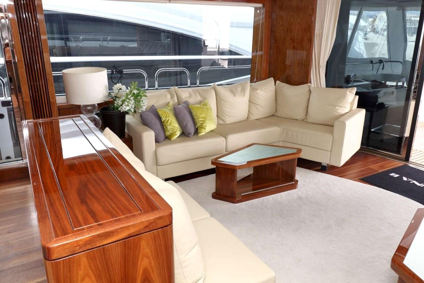a living room with a couch and a coffee table aboard SUNSEEKER 86 Yacht for Sale