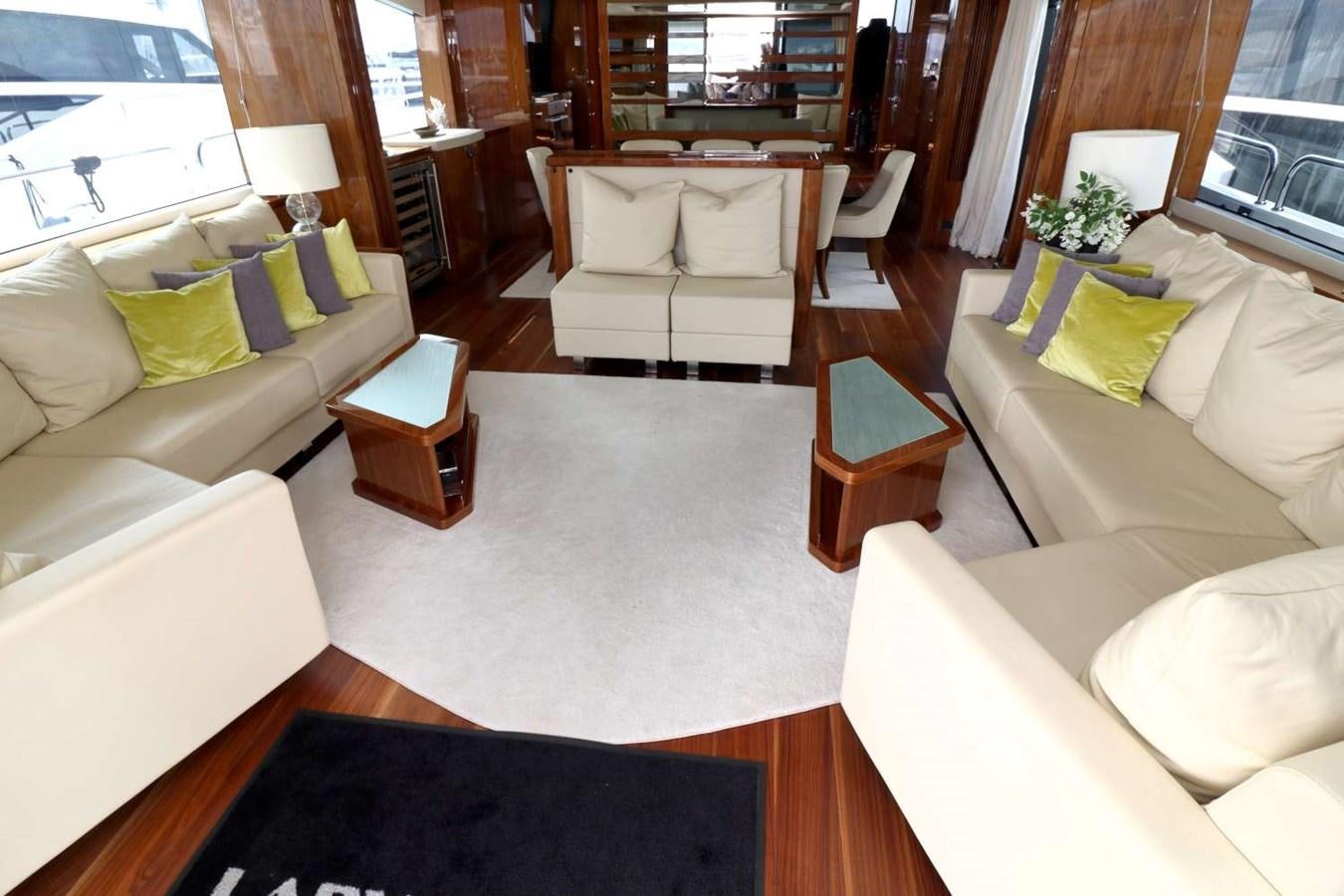 a living room with white couches aboard SUNSEEKER 86 Yacht for Sale