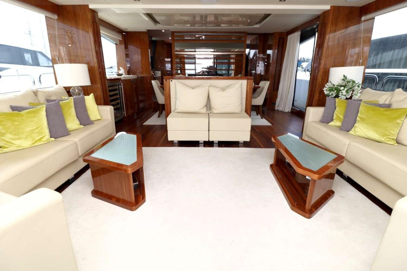a living room with a couch and a table aboard SUNSEEKER 86 Yacht for Sale