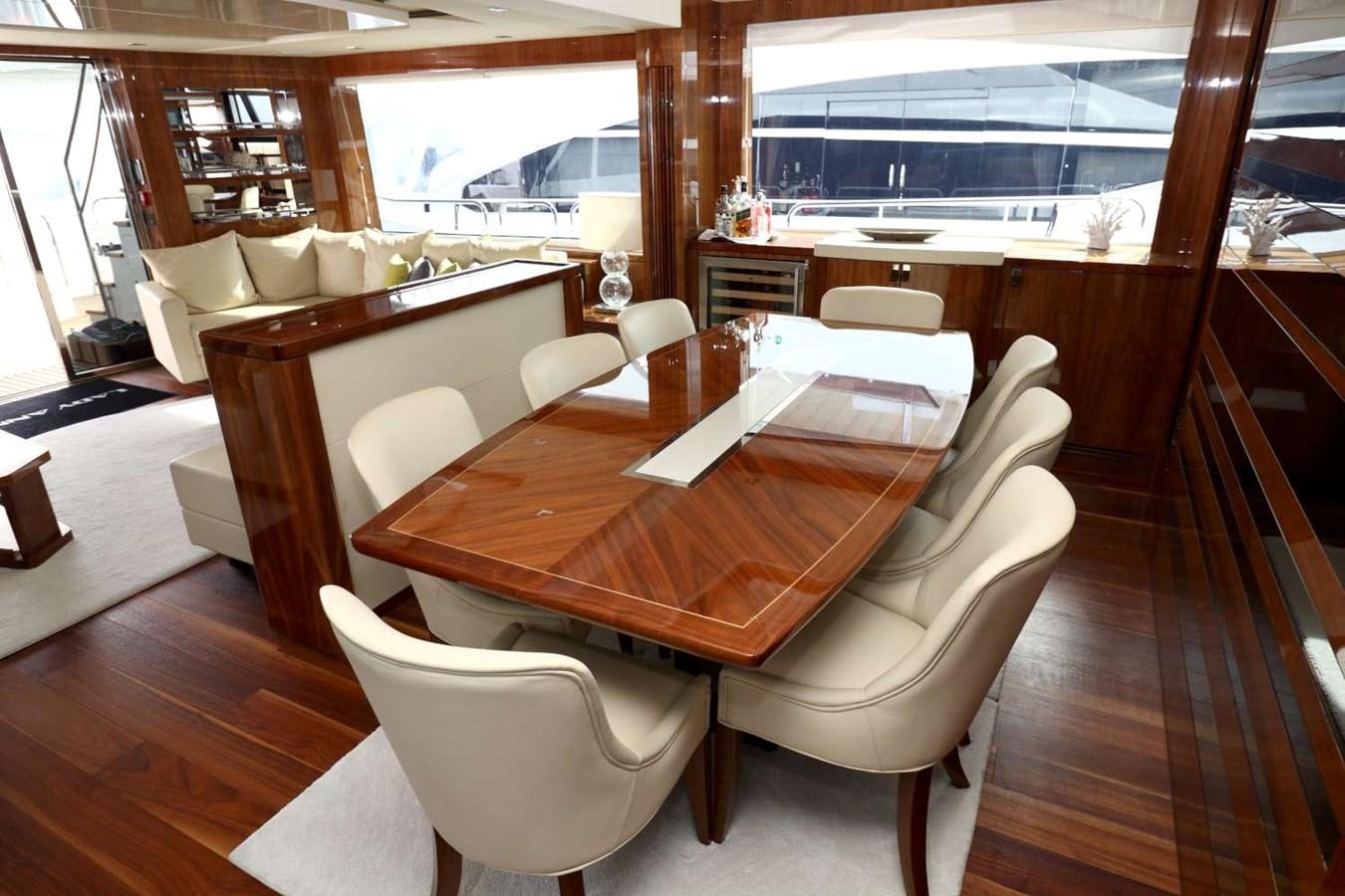 a table with chairs around it aboard SUNSEEKER 86 Yacht for Sale