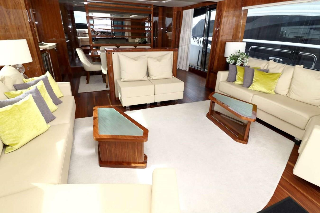 a living room with a couch and a coffee table aboard SUNSEEKER 86 Yacht for Sale