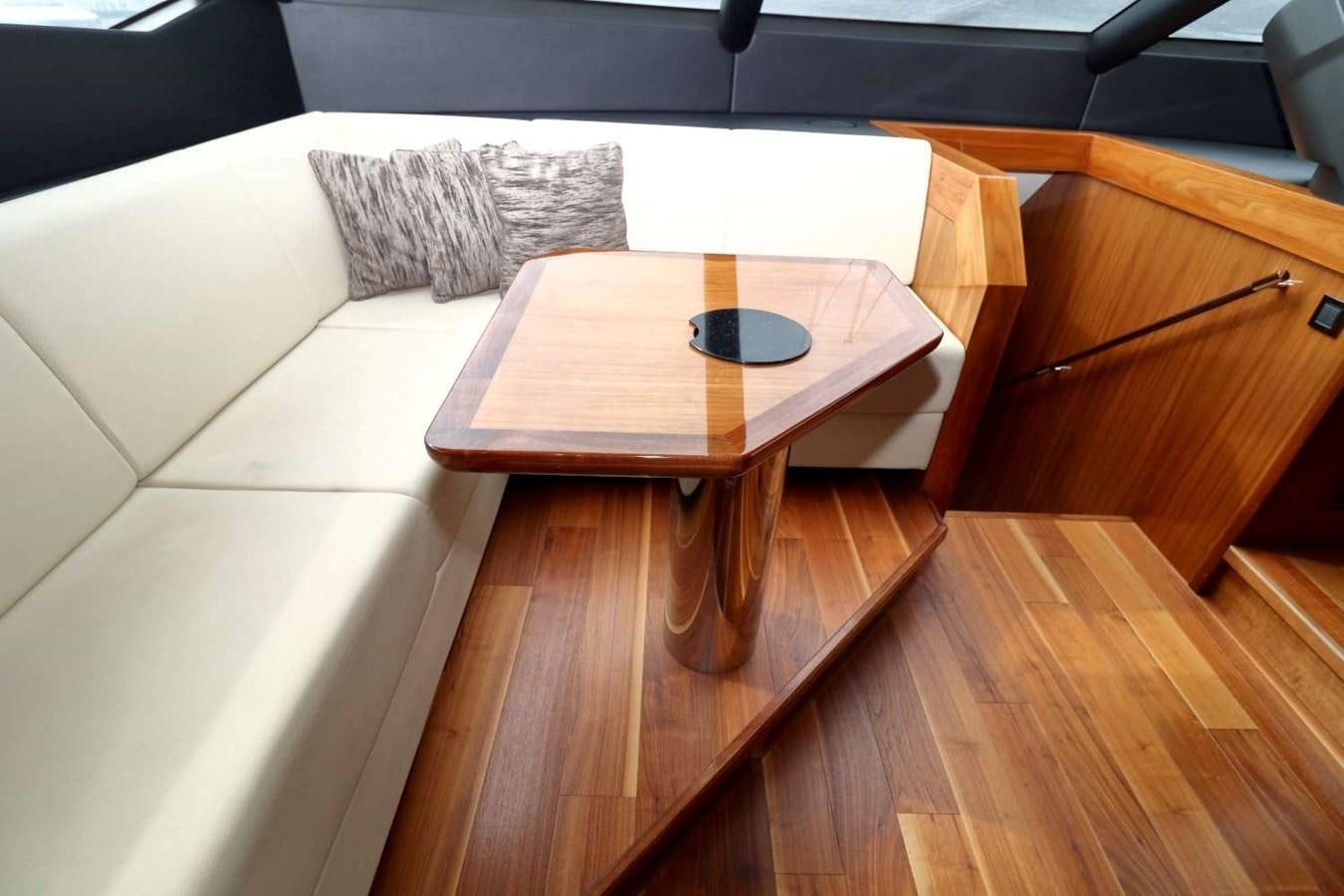 a table with a pillow on it aboard SUNSEEKER 86 Yacht for Sale