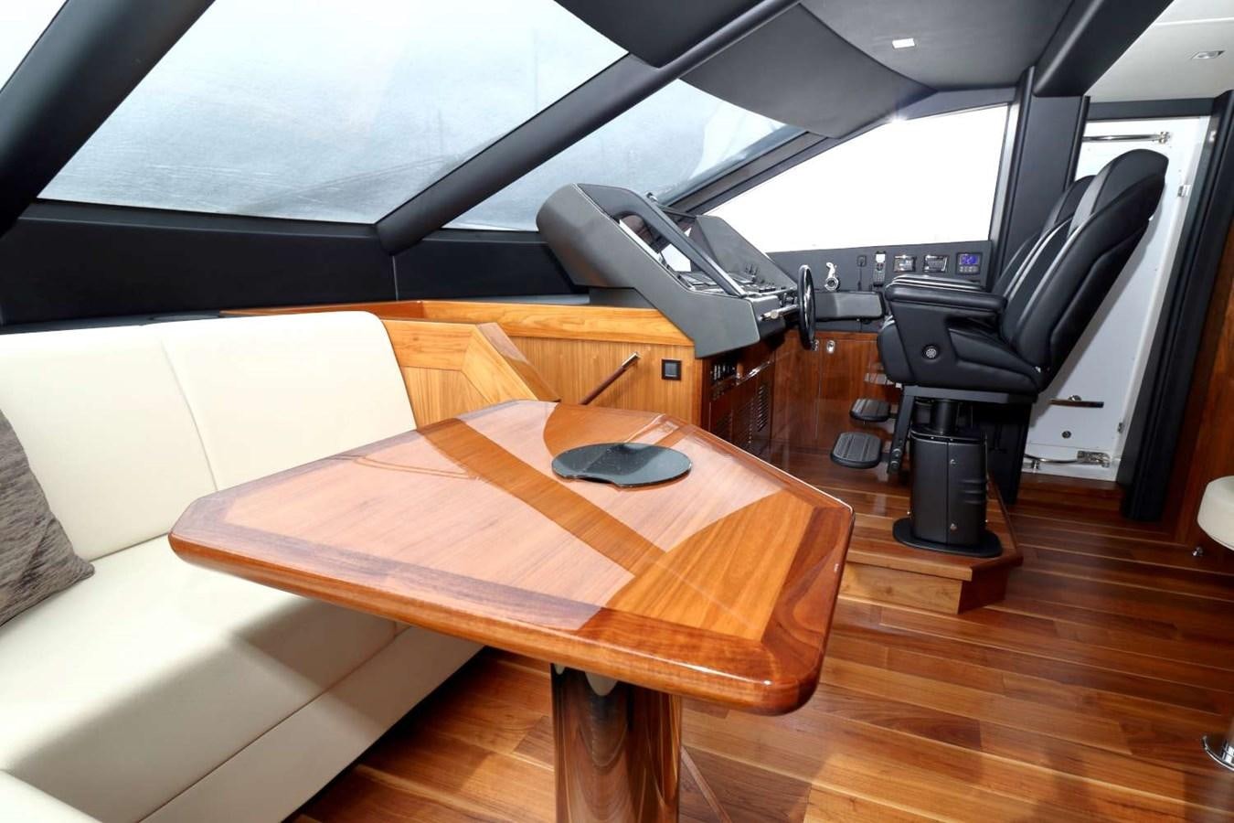 a room with a table and a computer aboard SUNSEEKER 86 Yacht for Sale