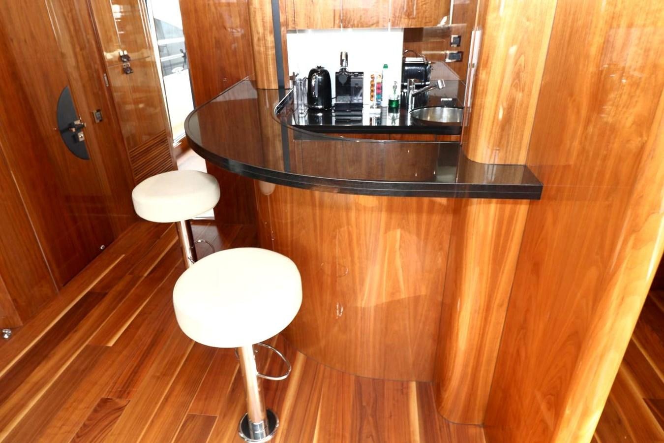 a bar counter with stools aboard SUNSEEKER 86 Yacht for Sale
