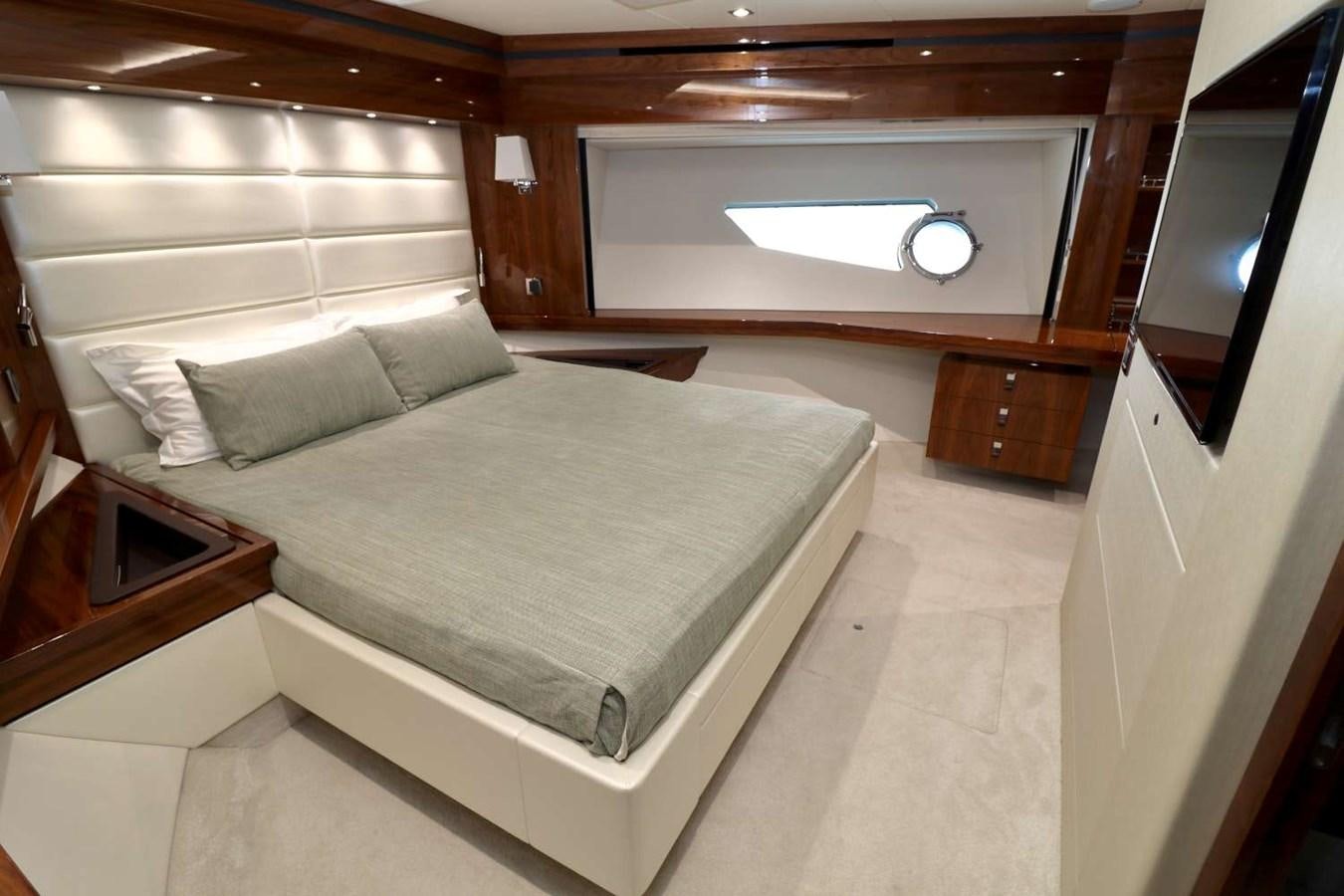 a bed in a room aboard SUNSEEKER 86 Yacht for Sale