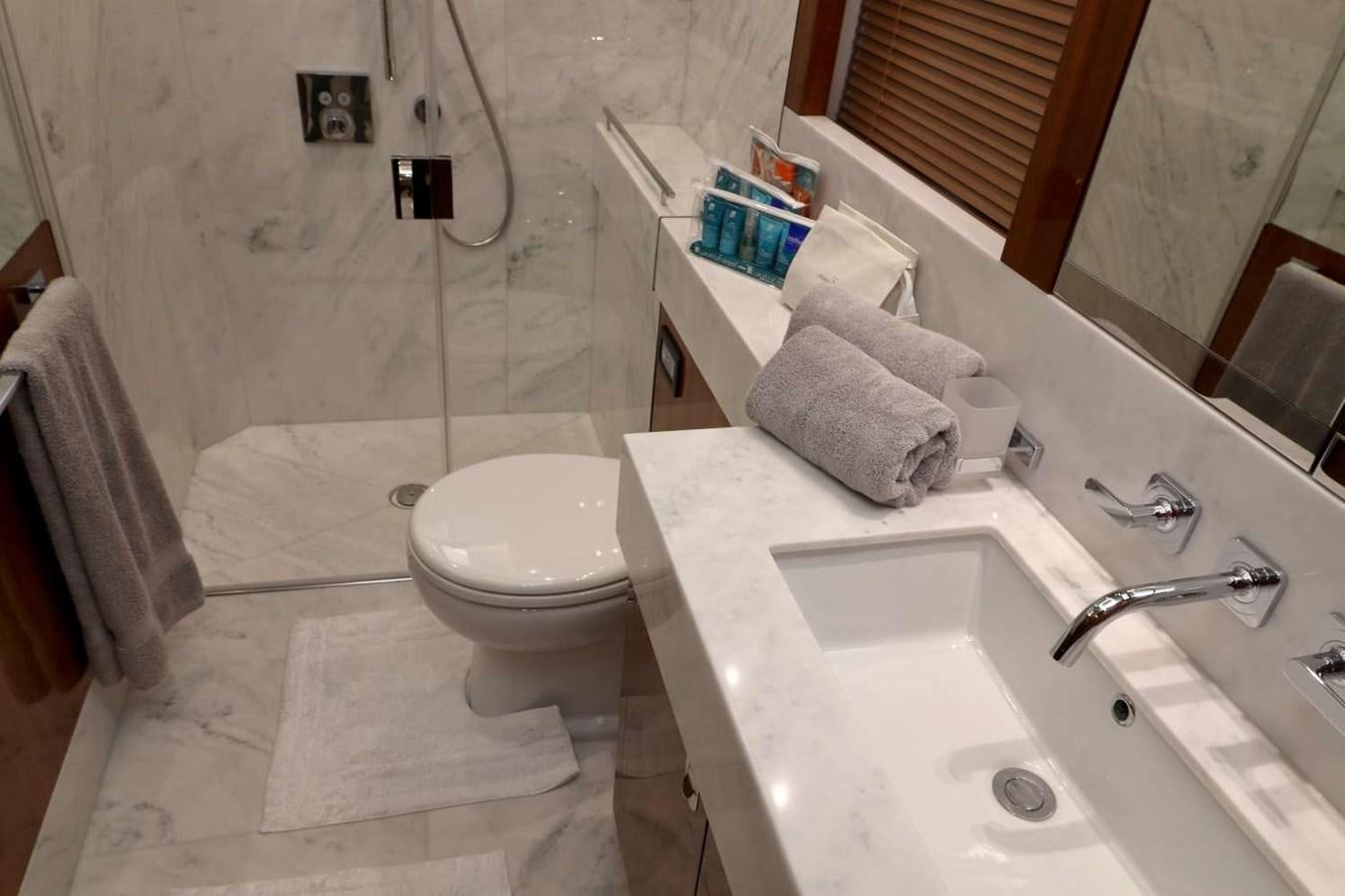 a bathroom with a toilet sink and a bathtub aboard SUNSEEKER 86 Yacht for Sale