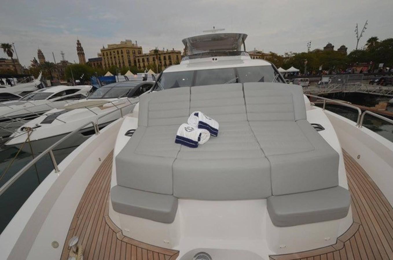 a rooftop of a building with many white rooftops and a white car parked on the roof with aboard SUNSEEKER 86 Yacht for Sale