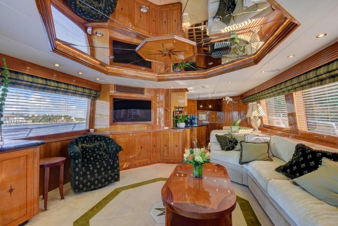 a living room with a couch and a table aboard SPHEREFISH Yacht for Sale