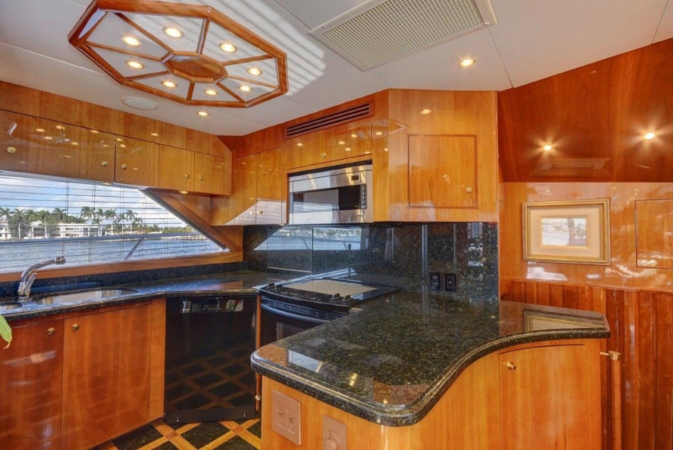 a kitchen with a large island aboard SPHEREFISH Yacht for Sale