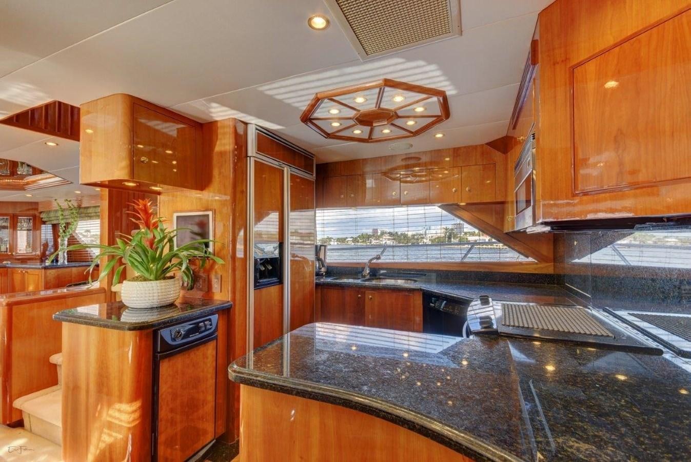 a kitchen with a large island aboard SPHEREFISH Yacht for Sale