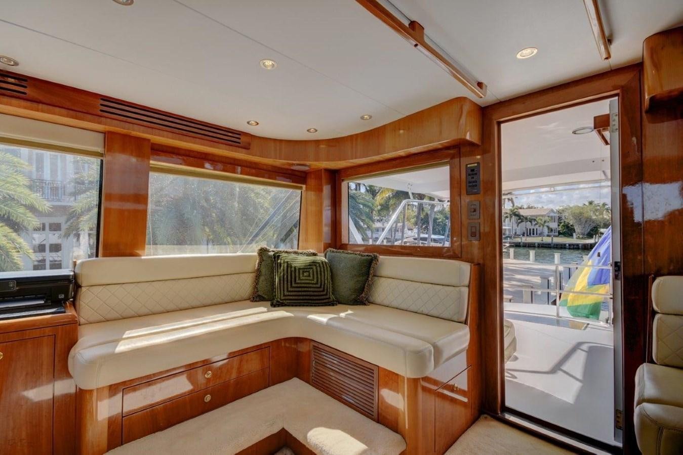 a living room with a couch and a window aboard SPHEREFISH Yacht for Sale
