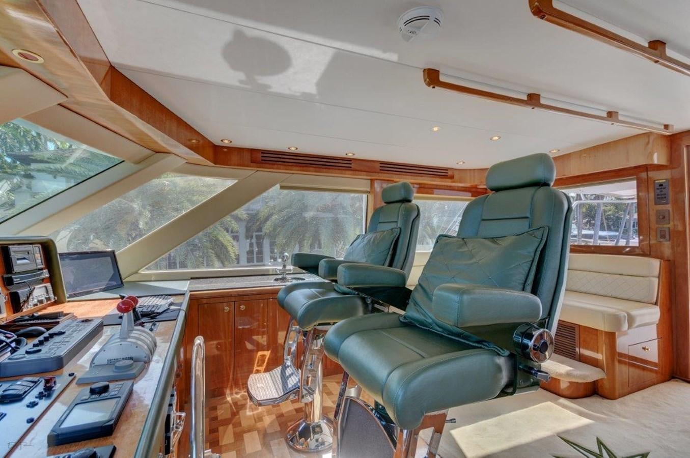 a room with a chair and desk aboard SPHEREFISH Yacht for Sale
